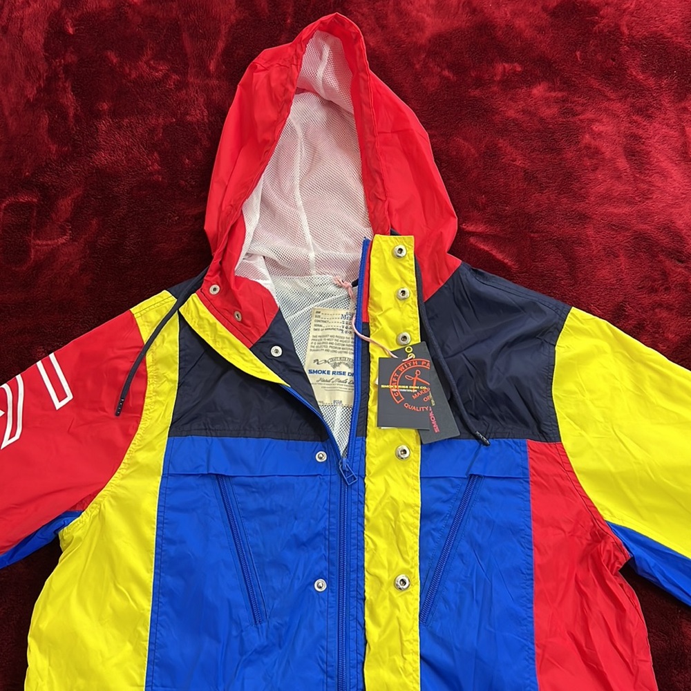 Brand new blue red and yellow jacket
